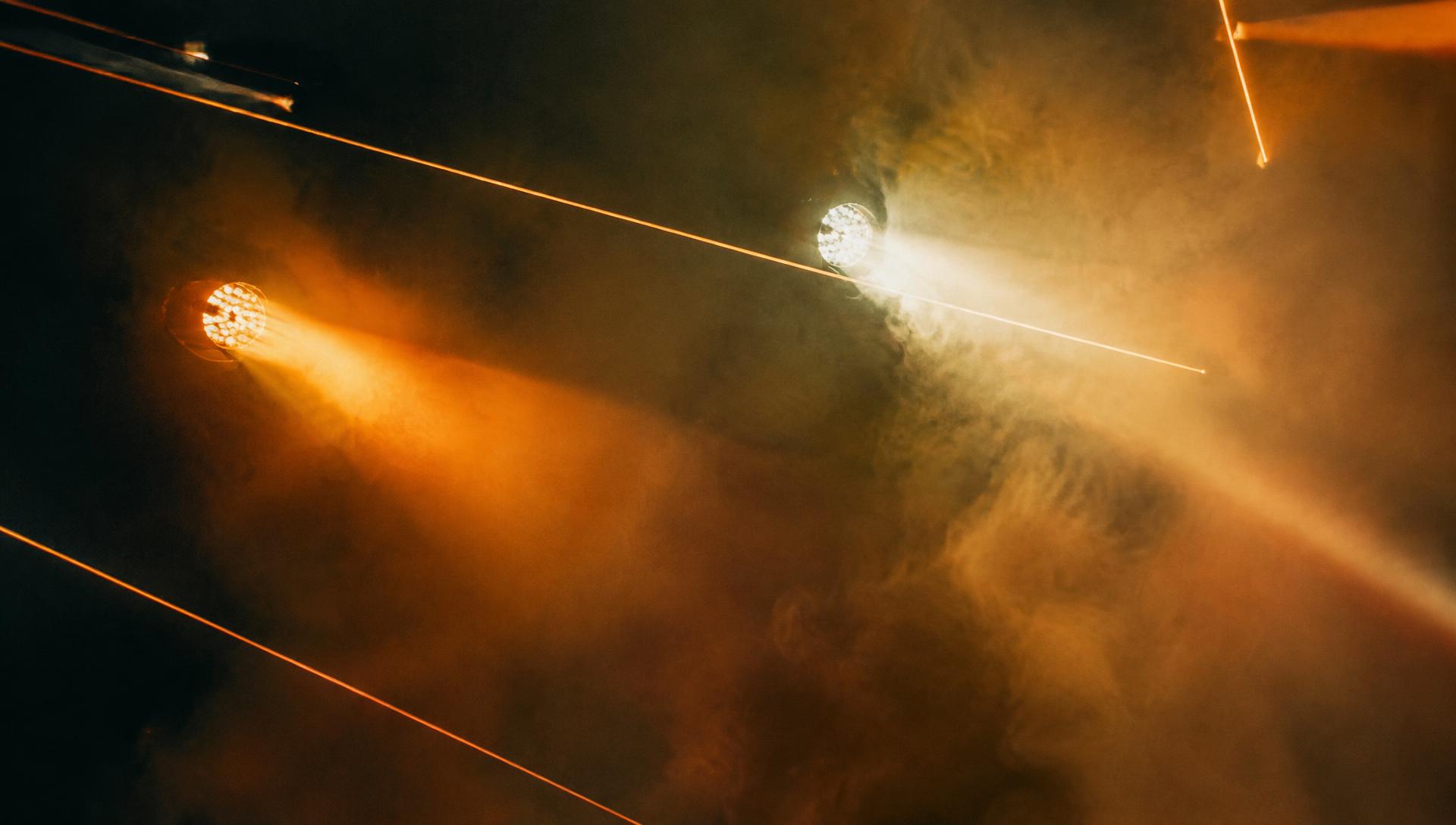 Stage light beams and laser lines in haze